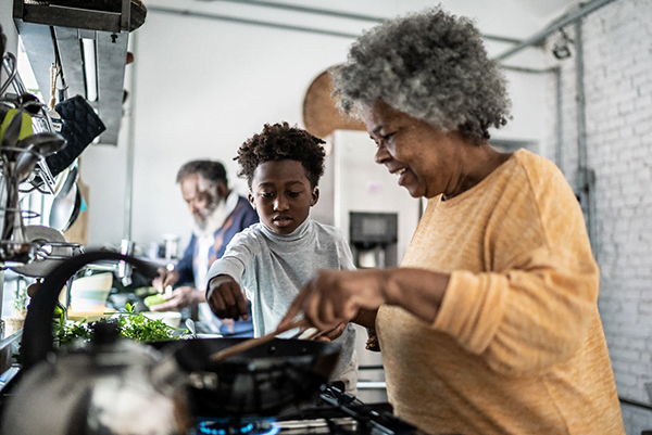 grandmother cooking with their grandkid