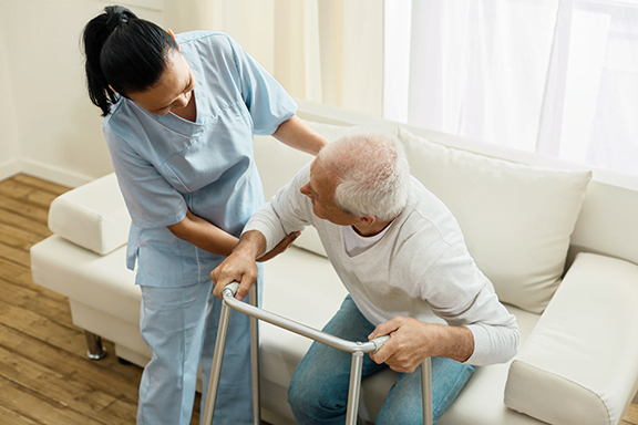 Pleasant friendly caregiver doing her job