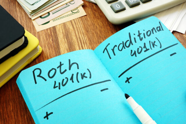 Blue notebook with roth and traditional 401(k)s written next to each other with + and - signs underneath